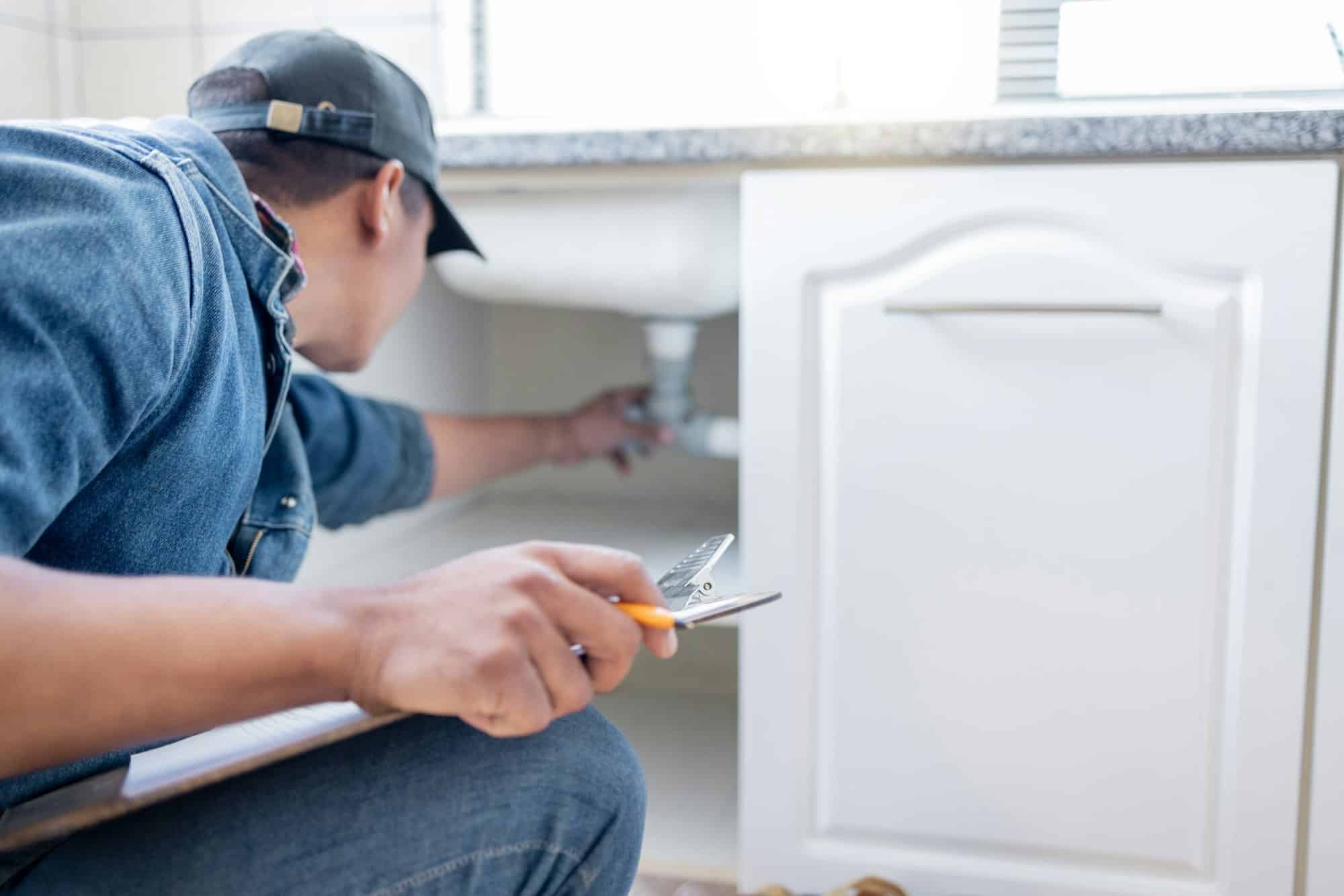 Plumber man, technician and clipboard document for pipeline, home renovation and quality assurance